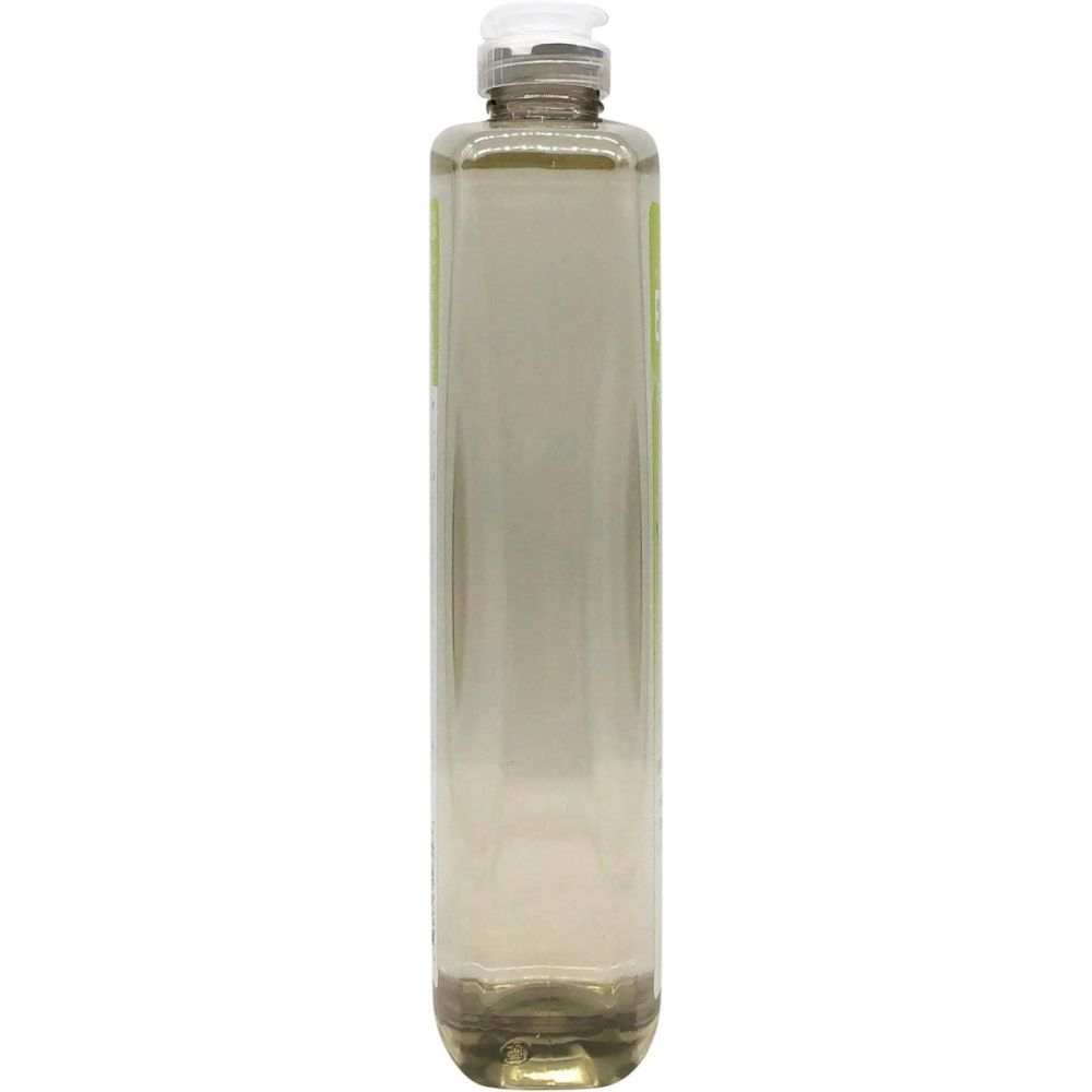 Clear plastic bottle filled with light liquid, screw cap, wellness product background