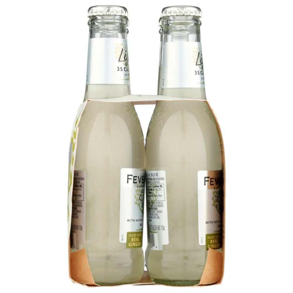 Pack of four clear glass bottles of light ginger beer with visible calorie label