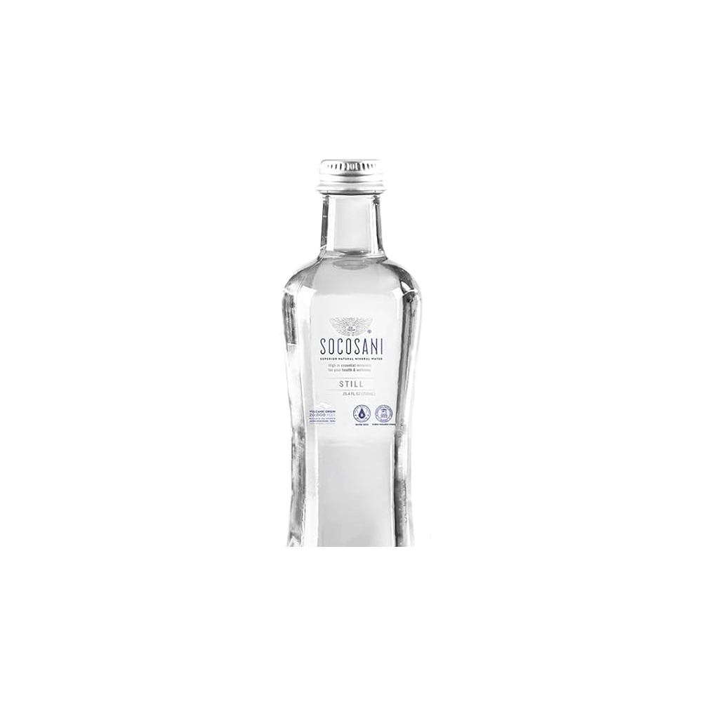 Clear glass bottle of Socosani still natural mineral water against black background