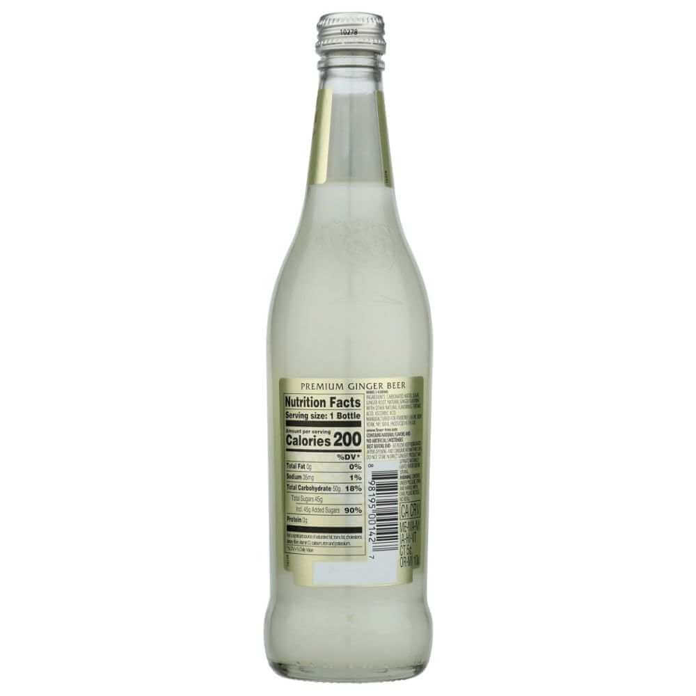 Clear glass bottle of premium ginger beer with visible nutrition facts label