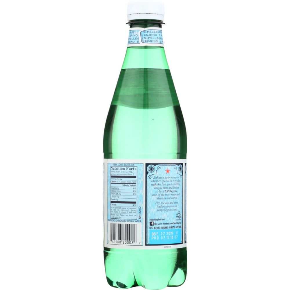 Green glass bottle of sparkling mineral water with nutrition label, white cap, rear view