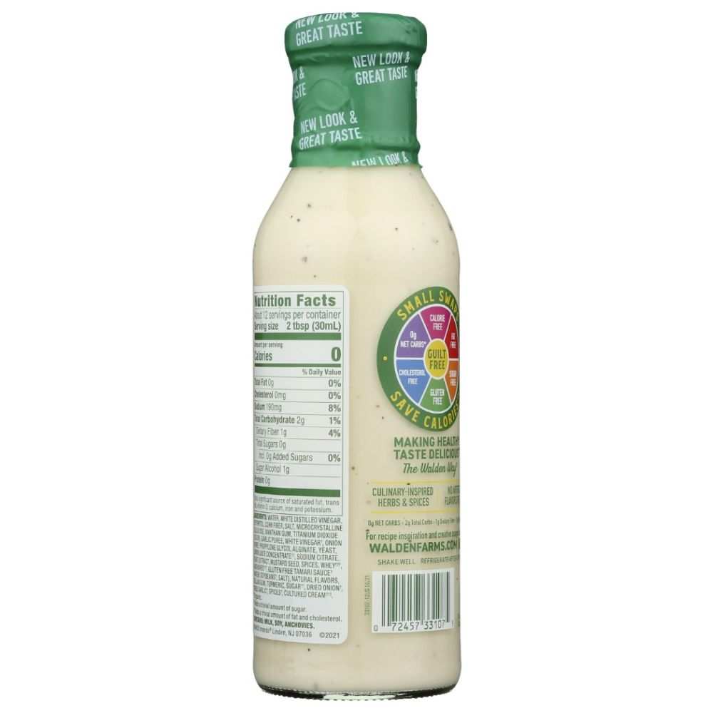 Walden Farms Caesar Zero Calorie Dressing bottle next to fresh leafy greens