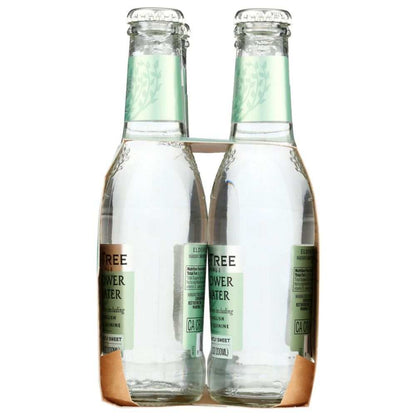 Four-pack of premium tonic water bottles in clear glass packaging